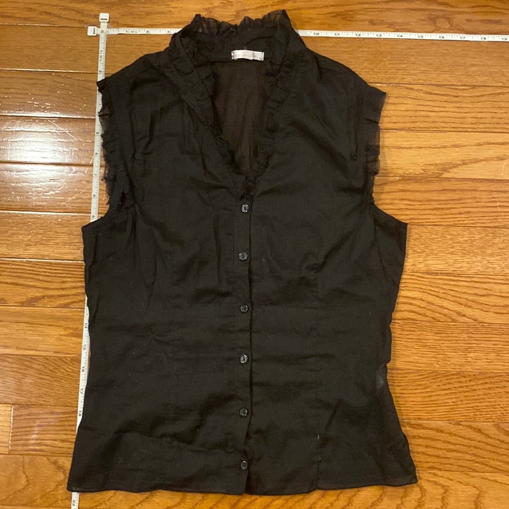 Sheer sleeveless top with ruffle trim